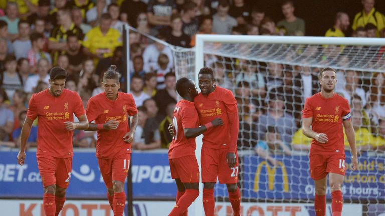 Liverpool's Belgian striker Divock Origi  is congratulated after scoring against Burton