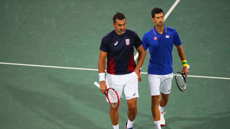 RIO DE JANEIRO, BRAZIL - AUGUST 08:  Novak Djokovic and Nenad Zimonjic of Serbia in discussion during the Men's Doubles second round match against Bruno So