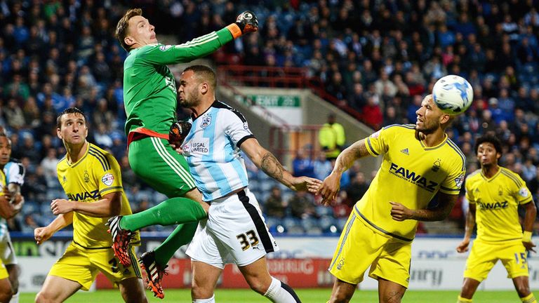 Nottingham Forest 'keeper Dorus de Vries punches the ball clear against Huddersfield