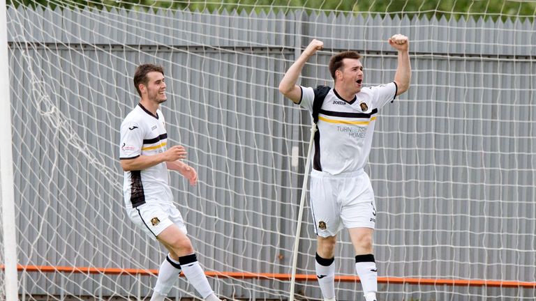 Dumbarton's Mark Docherty celebrates after scoring from the spot against Dundee United