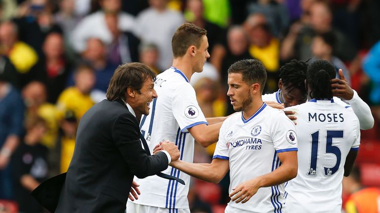 Hazard says he is enjoying his time playing under Antonio Conte (L)