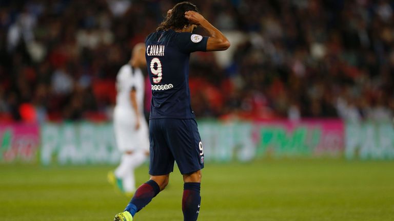 Paris Saint-Germain's Uruguayan forward Edinson Cavani reacts after missing a goal during the French Ligue 1