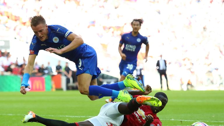 LONDON, ENGLAND - AUGUST 07: Eric Bailly of Manchester United tackles Jamie Vardy of Leicester City  during The FA Community Shield match between Mancheste