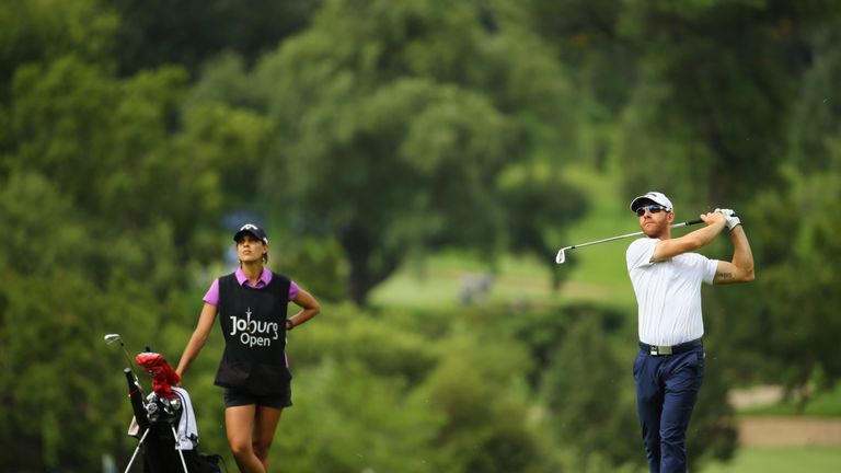 JOHANNESBURG, SOUTH AFRICA - JANUARY 14:  Estanislao Goya of Argentina is watched by caddie and Ladies European Tour player Henrietta Zuel on the East Cour