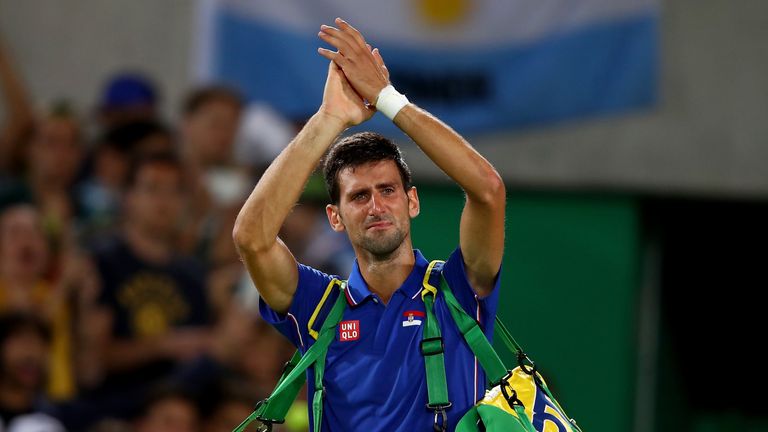 Novak Djokovic struggles to hold back tears after his first round loss to Argentina's Juan Martin Del Potro