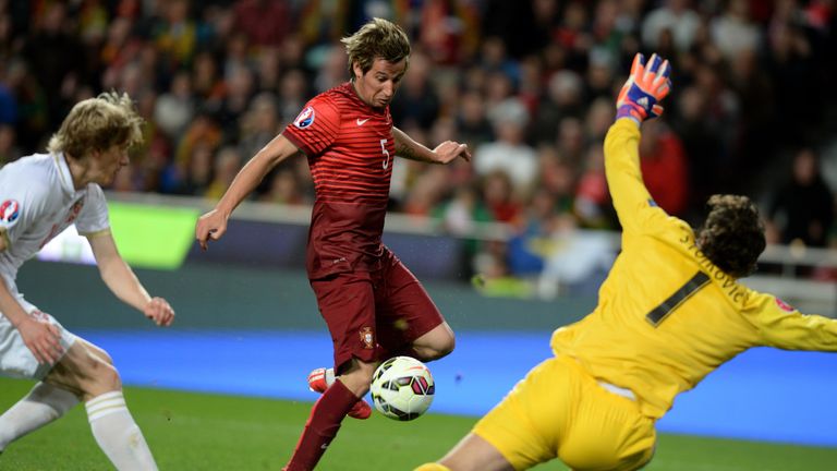 Portugal's defender Fabio Coentrao (C) kicks the ball to score a goal during the Portugal vs Serbia EURO 2016 qualifying football match at Luz stadium in L