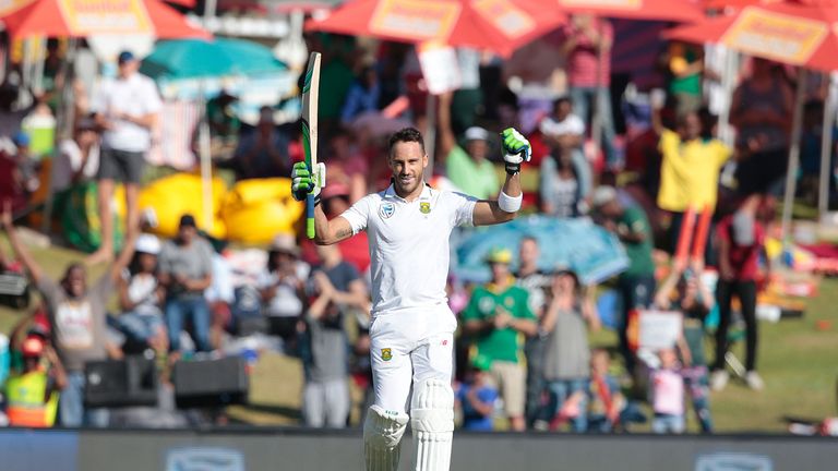 South African batsman and Captain Faf du Plessis raises his bat as he celebrates scoring a century