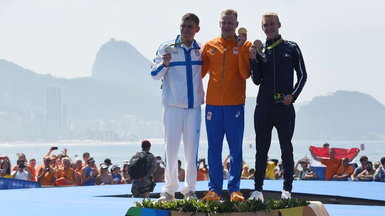 Dutch gold medallist Ferry Weertman (centre), second-placed Spiros Gianniotis (left) of Greece and French bronze winner Marc-Antoine Olivier on the podium