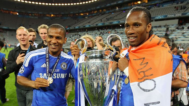 Didier Drogba (R) and  Florent Malouda of Chelsea celebrate with the trophy after their victory in the UEFA Champions League Final