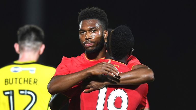 Daniel Sturridge celebrates Liverpool's fifth goal with Sadio Mane