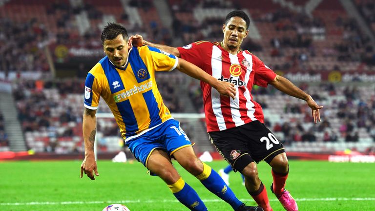 Steven Pienaar (R) and Antoni Sarcevic battle for possession