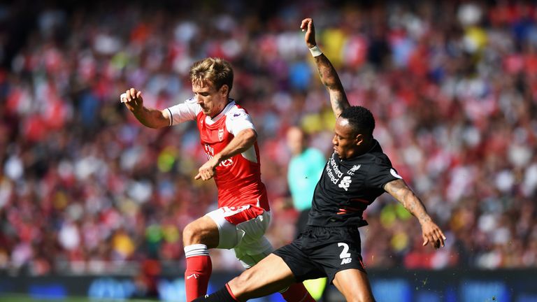 Nacho Monreal is challegned by Nathaniel Clyne