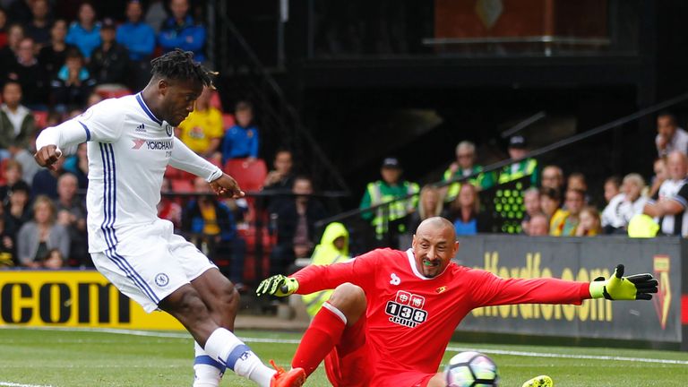 Michy Batshuayi (L) slots home past Watford goalkeeper Heurelho Gomes