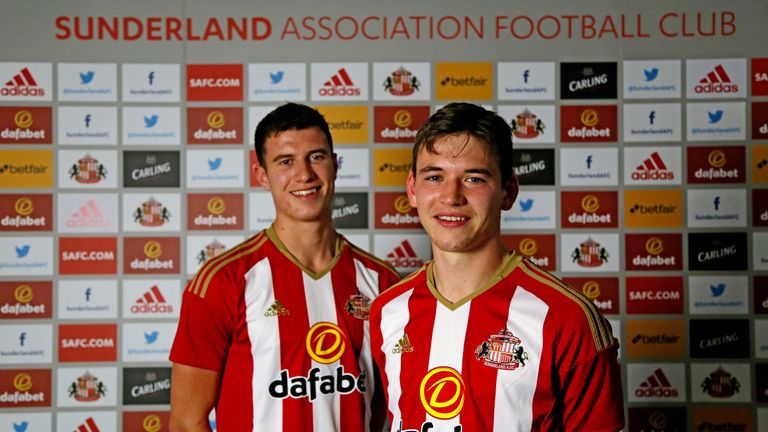Paddy McNair ( L) and Donald Love have signed permanent deals with Sunderland
