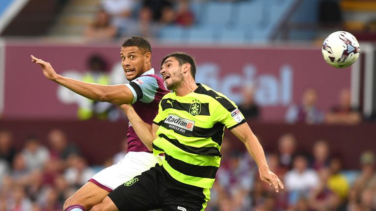 BIRMINGHAM, ENGLAND - AUGUST 16:  Rudy Gestede of Aston Villa and Christopher Schindler of Huddersfield Town in action during the Sky Bet Championship matc
