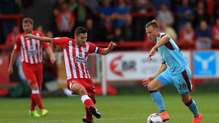 Accrington Stanley's Seamus Conneely looks to put pressure on Burnley's Fredrik Ulvestad (right) 