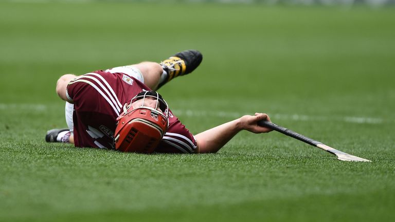 Joe Canning of Galway lies injured for Galway