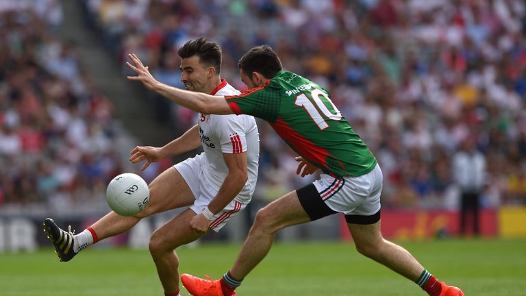 Tiernan McCann of Tyrone in action against Kevin McLoughlin of Mayo 
