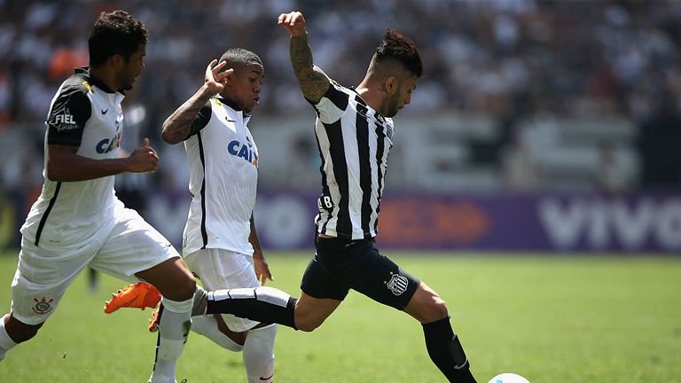 Yago and Malcom of Corinthians fights for the ball with Gabriel of Santos during the match between Corinthians and Santo