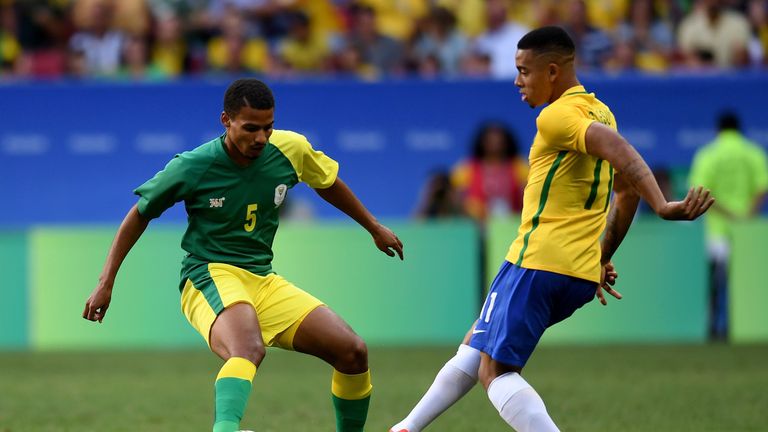 South Africa player Rivaldo Coetzee (L) vies for the ball with Brazil player Gabriel Jesus during the Rio 2016 Olympic Games First Round Group A men's foot