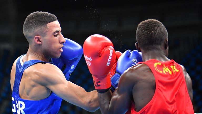 Great Britain's Galal Yafai (L) lands a punch on Cameroon's Simplice Fotsala during the Men's Light Fly (46-49kg) match at the Rio 2016 Olympic Games