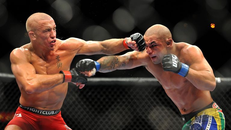 LAS VEGAS - JULY 11:  (L-R) Georges St. Pierre battles Thiago Alves during their welterweight title bout during UFC 100 on July 11, 2009 in Las Vegas, Neva