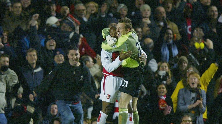 Graham Stack of Arsenal celebrates with Sylvain Wiltord after he scored the winning penalty for Arsenal during the Carling Cup Third 