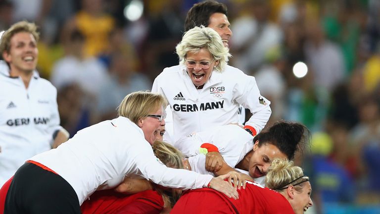Head coach Silvia Neid of Germany celebrates with their players following the Women's Olympic Gold Medal 