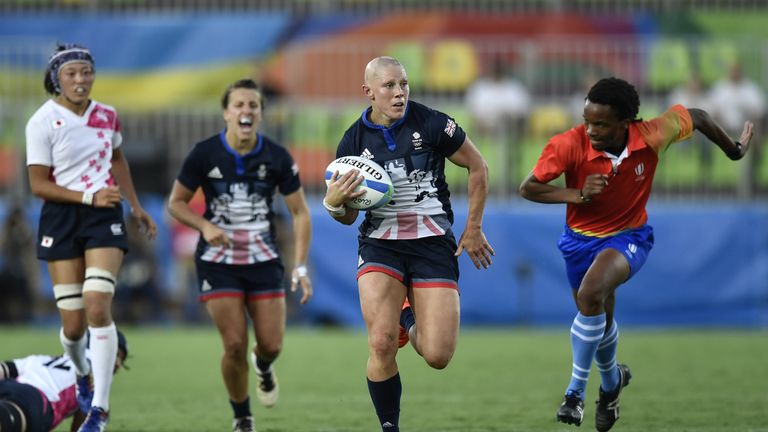 Britain's Heather Fisher runs with the ball 