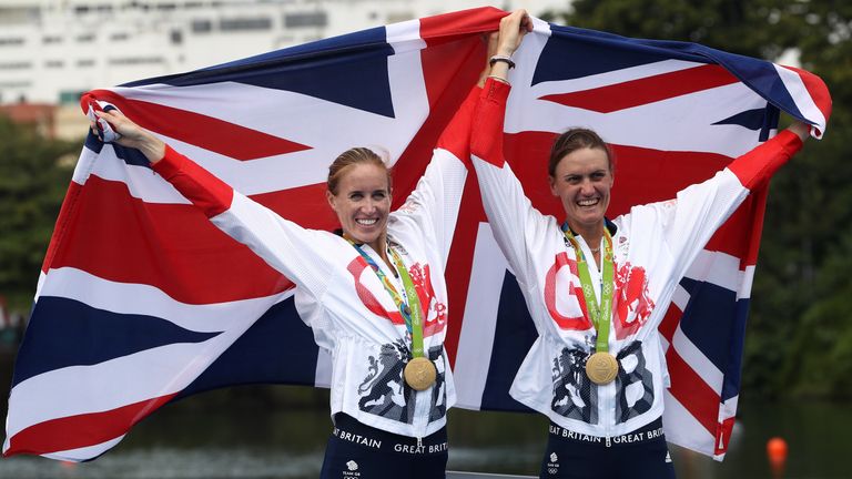 Gold medalists Helen Glover (L) and Heather Stanning (R) of Great Britain pose for photographs after the medal ceremony