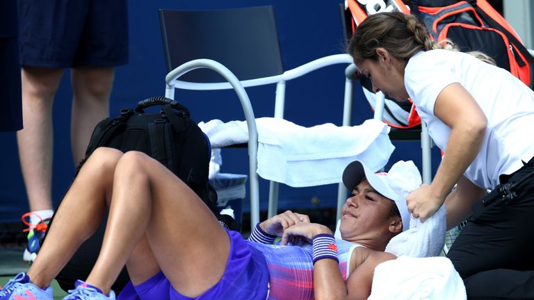 NEW YORK, NY - AUGUST 30:  Heather Watson of the United Kingdom is treated by a trainer during her first round Women's Singles maduring her first round Wom