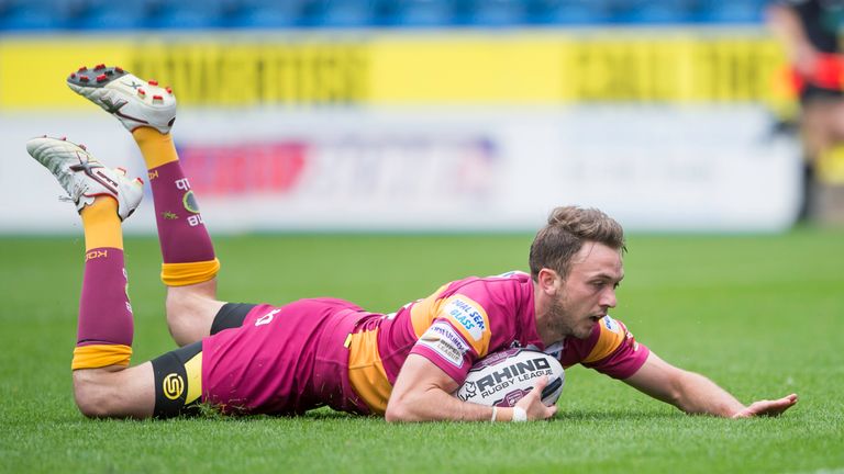 Huddersfield's Ryan Brierley touches down for a try against Featherstone.