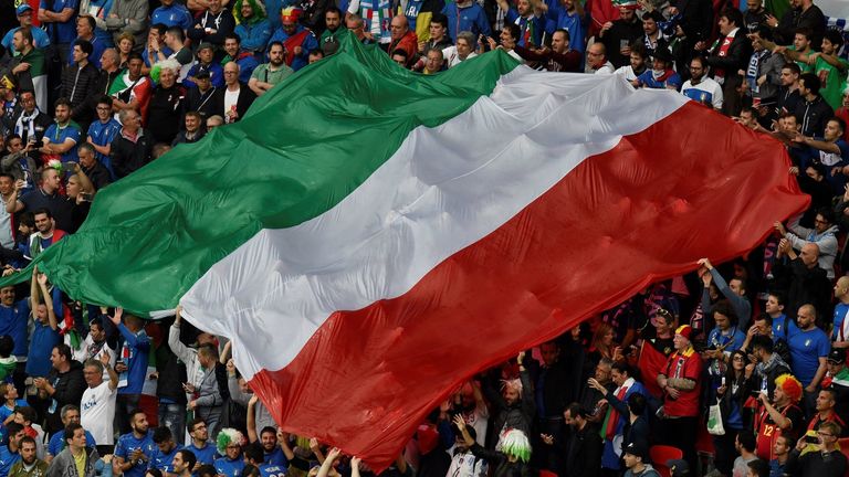 Italy supporters hold up a huge Italian flag during the opening ceremony prior to the start of the Euro 2016 group E football match between Belgium and Ita