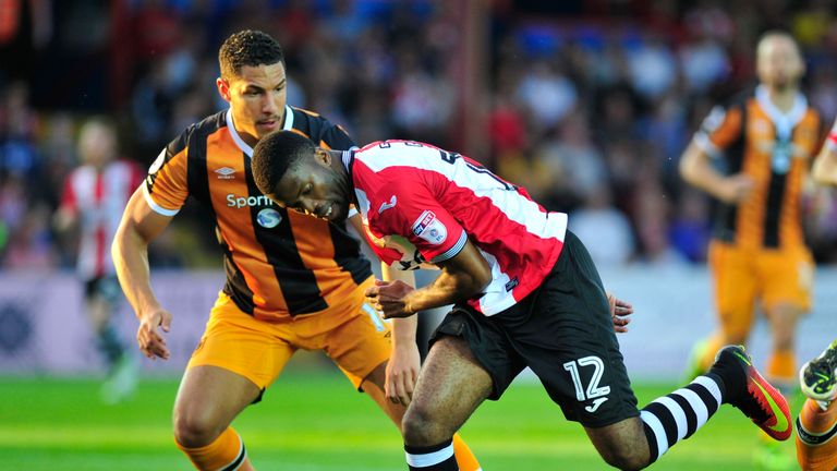 Exeter City's Jeol Grant and Hull City's Jake Livermore (left) in action during the EFL Cup, Second Round match at St James Park, Exeter.
