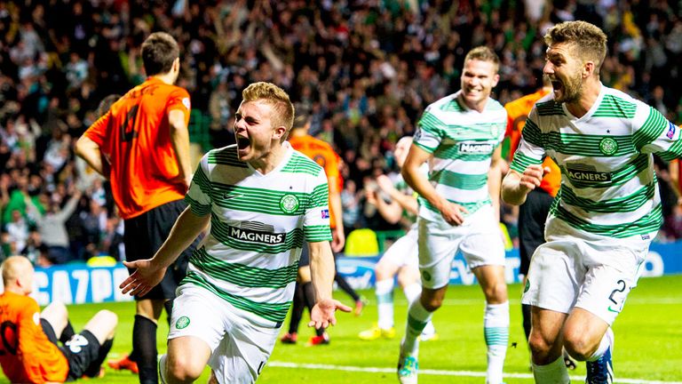 James Forrest and Charlie Mulgrew (right) celebrates Celtic's late winner against Shakhter Karagandy