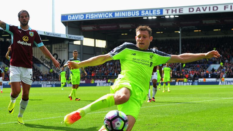 BURNLEY, ENGLAND - AUGUST 20: James Milner of Liverpool attempts to keep the ball in play during the Premier League match between Burnley and Liverpool at 