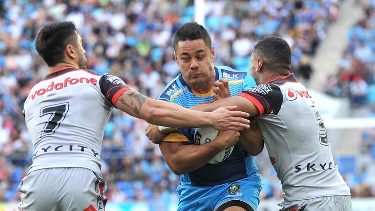 Jarryd Hayne of the Titans takes on the defence in his first run and first match for the club during the round 22 of NRL 2016