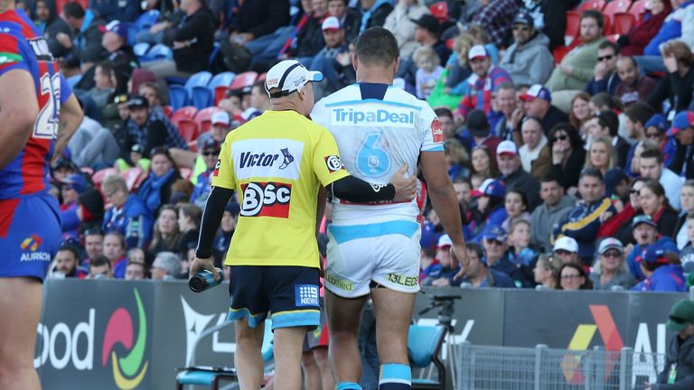 Jarryd Hayne of the Titans leaves the ground after getting injured during the round 24 NRL match against the Newcastle Knights