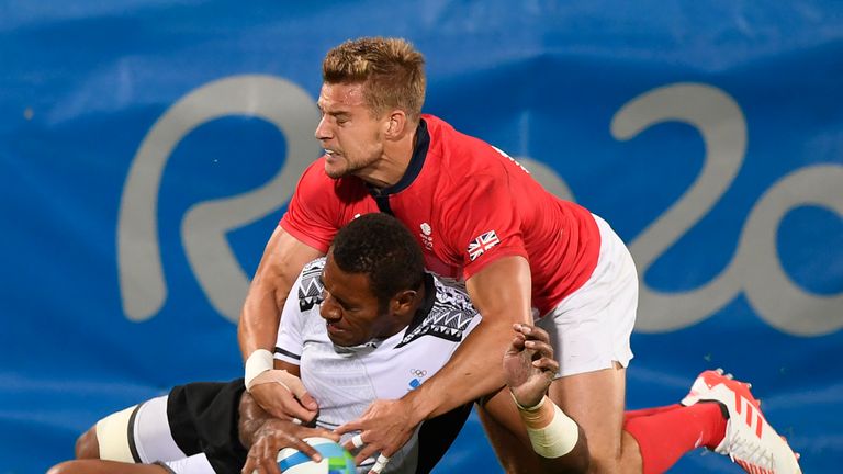 Fiji's Jasa Veremalua scores a try in the mens rugby sevens gold medal match between Fiji and Britain during the Rio 2016 Olympic Games at Deodoro Stadium 