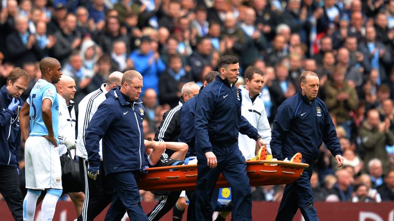 Rodriguez is stretchered off the pitch after landing awkwardly at the Etihad Stadium in April 2014