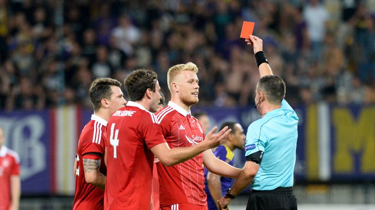 Aberdeen's Jayden Stockley (centre) is shown a red card against Maribor in Europa League