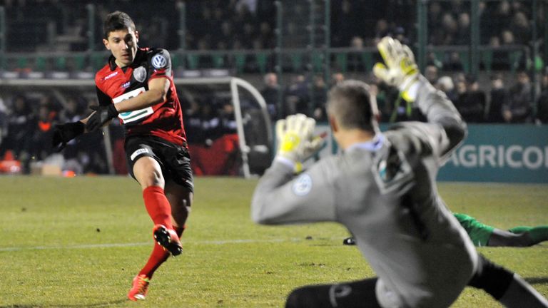 Guingamp's French midfielder Jeremy Pied (L) scores his team's third goal, during extra time in the French Cup Football match Yzeure vs Guingamp at the Bel