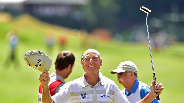 Jim Furyk of the United States celebrates after shooting a record setting 58 during the final round of the Travelers Championship