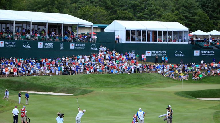 Jim Furyk hits his approach shot on the 18th hole during the final round of the Travelers Championship at TCP River Highlands