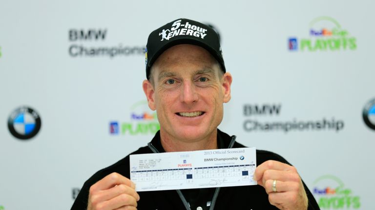 Jim Furyk holds up his scorecard after shooting a 12 under round of 59 during the Second Round of the BMW Championship in 2013