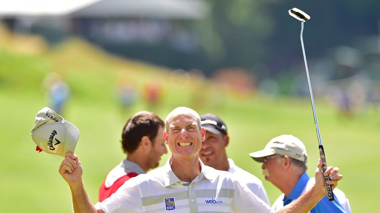 Jim Furyk of the United States celebrates after shooting a record 58 during the final round of the Travelers Championship