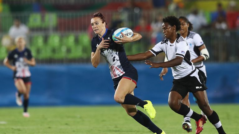 Joanne Watmore of Team GB carries the ball under pressure against Fiji during the Olympics Rugby 7s