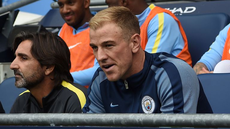 Joe Hart sits on the bench after being dropped for Manchester City's opening game of the season.
