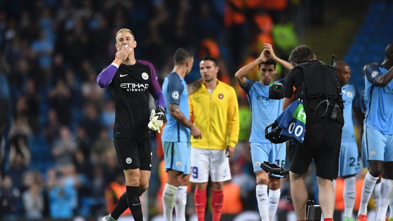 Manchester City's English goalkeeper Joe Hart (L) gestures to the crowd after the UEFA Champions League second leg play-off football match between Manchest