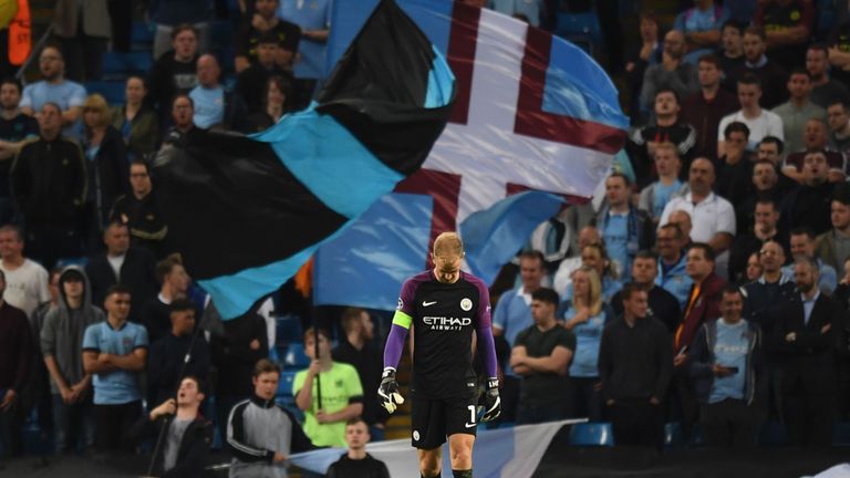 Manchester City's English goalkeeper Joe Hart walks on the field at the end of the UEFA Champions League second leg play-off football match between Manches